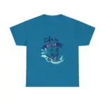 Teal blue crew neck t-shirt laid flat showing centered 'Life is Better at the Lake' graphic with wave splash and sailboat design on white background