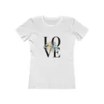 Flat lay photograph of a white short-sleeve crew neck t-shirt featuring 'LOVE' text in large black letters with decorative watercolor flowers in peach and blue tones integrated into the lettering, displayed on a white background"