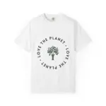 Flat lay photograph of a white short-sleeve crew neck t-shirt featuring a centered circular design with 'LOVE THE PLANET' text in dark letters arranged around a tree graphic in sage green, displayed on a white background