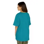 Woman with long brown hair shown from behind wearing an oversized teal blue short-sleeve t-shirt and olive green pants against a white background